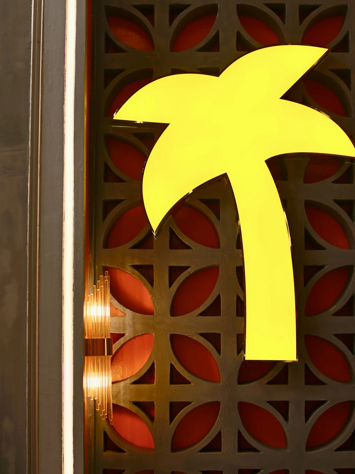 Palm-tree mural and warm lighting inside California Steaks